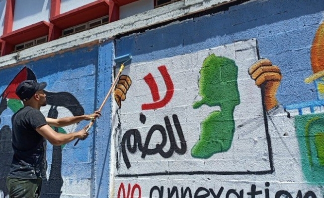 Filistinli gençler, İsrail’in ilhakını grafiti çizerek protesto etti